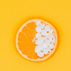 Orange halb gefüllt mit Pillen: Natsana Success Story