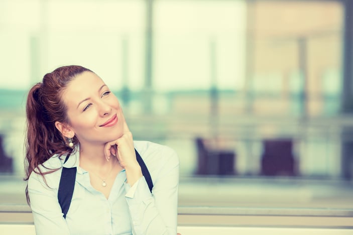 Portrait happy young woman thinking dreaming has many ideas looking up isolated office windows background. Positive human face expression emotion feeling reaction. Decision making process concept-1